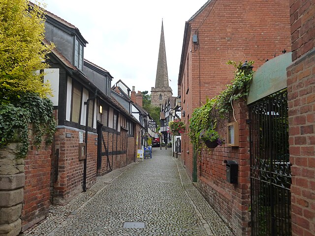 A view of Church Lane in Ledbury. There are black and white houses 